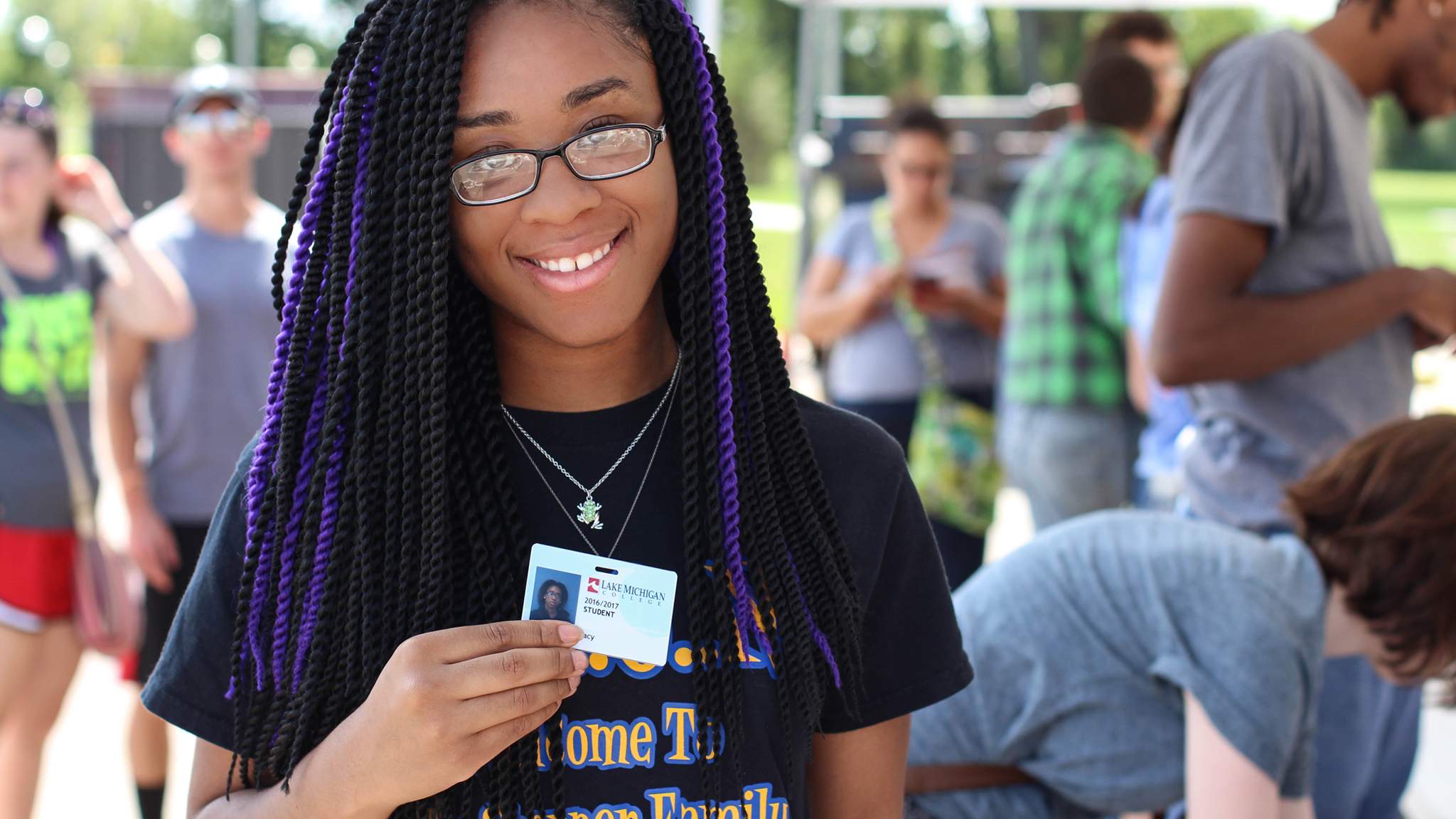 Student with student ID badge