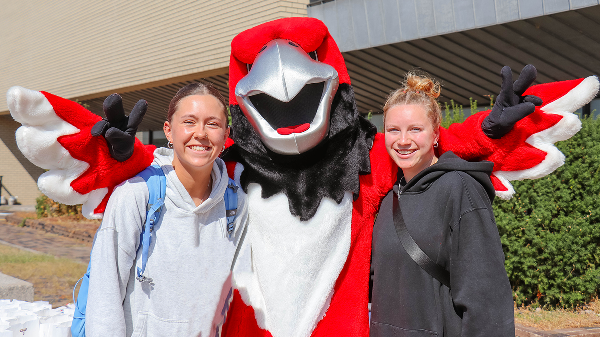 Students with Rocky the Red Hawk