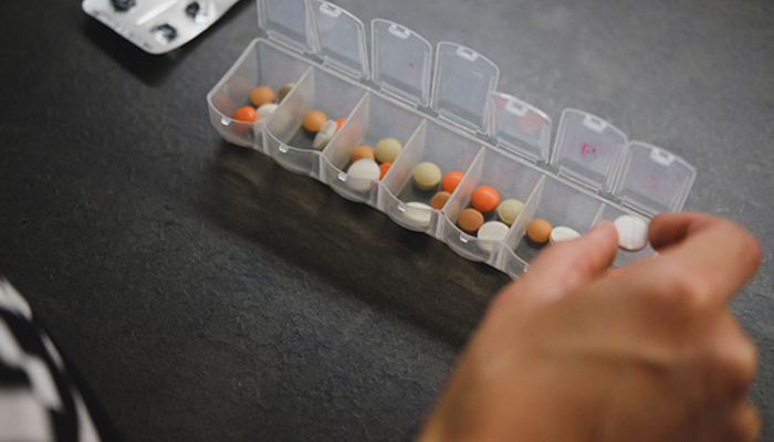 Person sorting pills