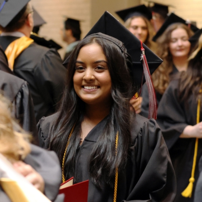 LMC Graduate showing her pride with a huge smile.