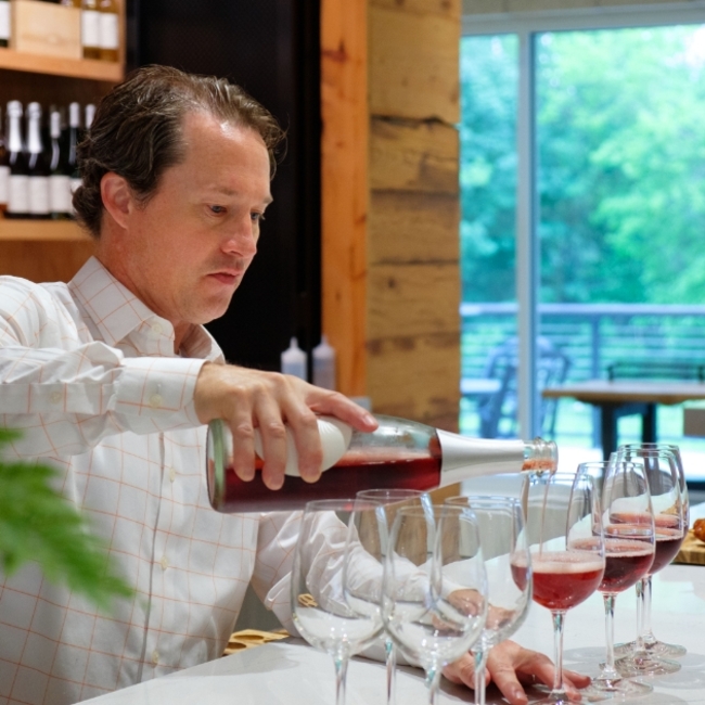 The art of pouring wine is demonstrated with precision.