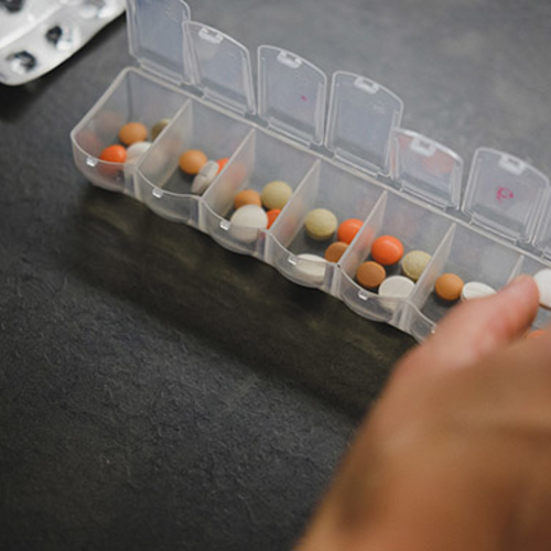 Person sorting pills