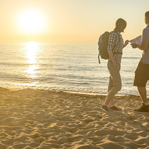 Students on the beach at sunset